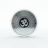 Silver coin with Om symbol on a white background