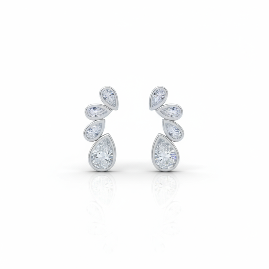 Pair of silver teardrop earrings on a white background