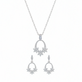 Silver necklace and earrings set on a white background