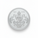 Silver coin with engraved design on a white background