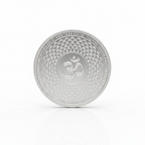 Decorative plate with a textured design and Om symbol on a white background