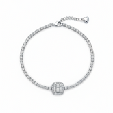 Silver bracelet with a central diamond on a white background