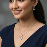 Woman wearing a necklace and earrings against a blurred background