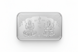 Silver bar with engraved designs on a white background