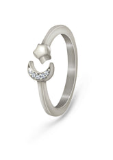 A silver ring featuring a star and crescent moon motif with a small diamond-like embellishment in the center, set on a simple band.