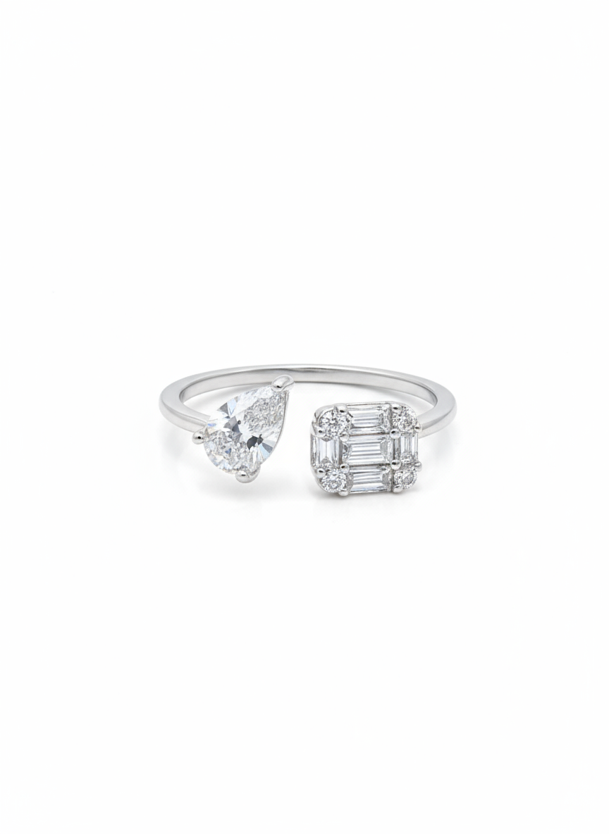 Silver ring with two diamond-shaped gemstones on a white background