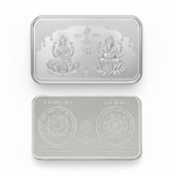 Two silver bars with engravings on a white background
