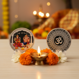 Decorative items with divine figures and floral arrangements on a table with a blurred festive background.