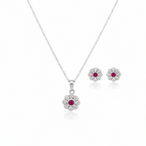Silver jewelry set with flower-shaped pendants on a white background
