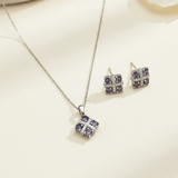 Jewelry set with necklace and earrings on a light background