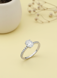 Silver ring with a diamond on a yellow background for diwali wear