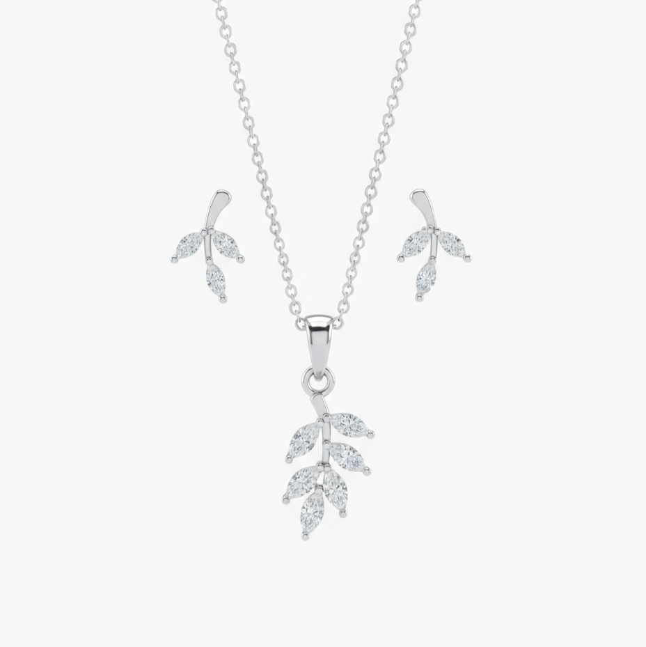 Silver leaf-shaped necklace and earrings on a white background